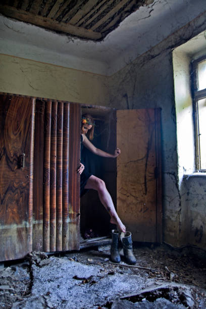 istock Women in black in the closet 698595818