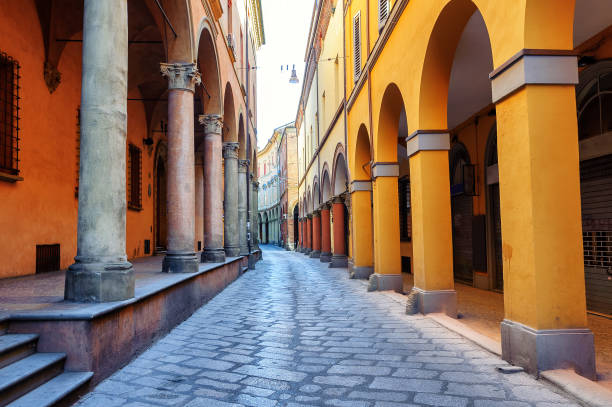 Historical street in Bologna, Italy Historical arcade street in the old town of Bologna, Italy bologna photos stock pictures, royalty-free photos & images