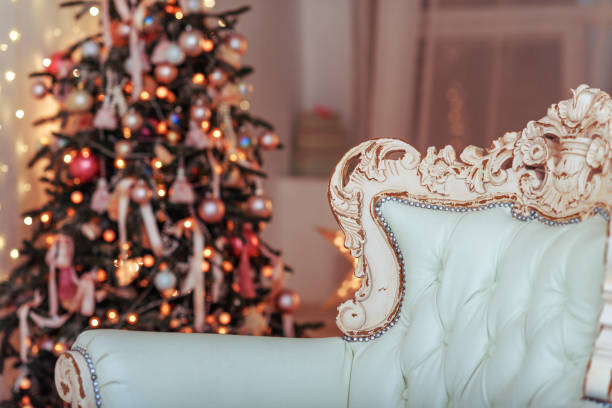 istock Christmas Tree and Christmas gift boxes in the interior with a fireplace. 698614908