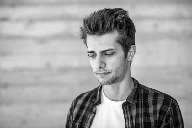 istock serious young man black&white portrait 698615056