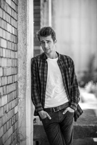 istock serious young man black&white portrait 698615208