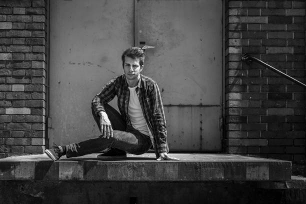 istock young man crouching on ramp of warehouse 698615230