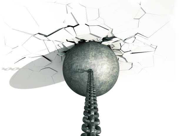 istock Metallic Wrecking Ball Shattering The White Wall 698622312