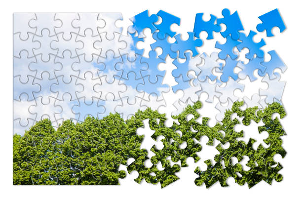 istock Green trees against a cloudy sky - concept image in puzzle shape 698627336