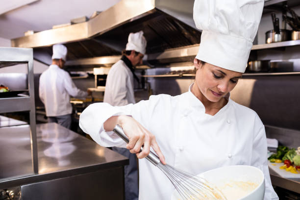 istock Chef whisking bowl of eggs 698628762