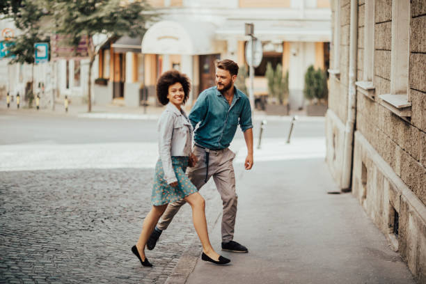 istock Handsome hipster is looking at his beautiful girlfriend 698629316