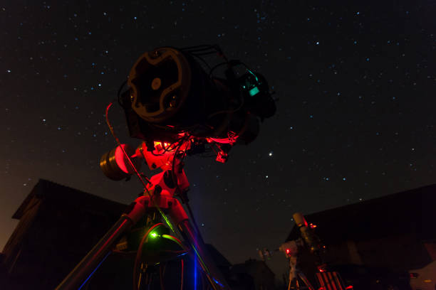 istock Professional astrophotography telescope taking pictures under night sky 698636446