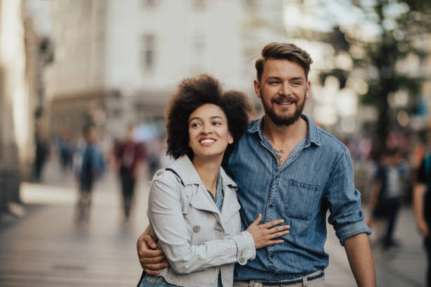 istock Young couple went out for a walk at the square 698647318