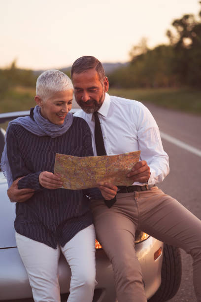 istock Mature couple at car 698648522