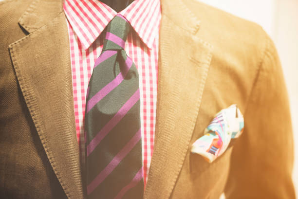 Purple necktie with trinity tie knot on a sofa, close-up, vintage toned