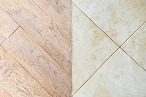 istock Wooden laminate floor and marble tile 698654478