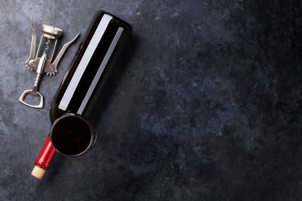 istock Red wine glass and bottle 698673220