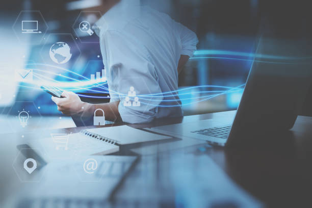 istock businessman hand working with mobile smart phone in modern office with virtual icon diagram 698677756