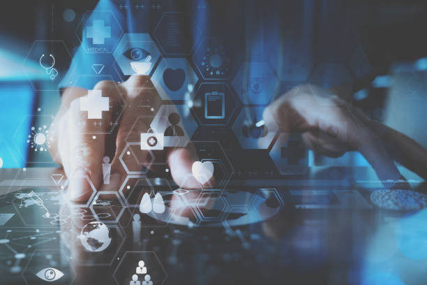 istock smart doctor hand working with modern laptop computer in modern office with virtual icon diagram 698677772
