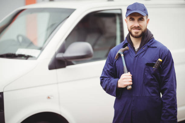 istock Repairman holding a hammer 698683702