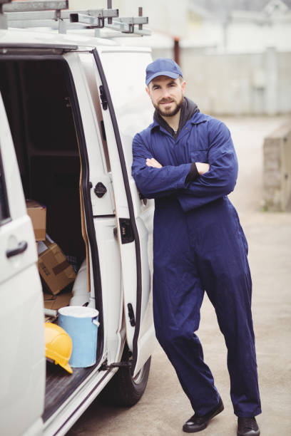 istock Repairman with arms crossed 698684146