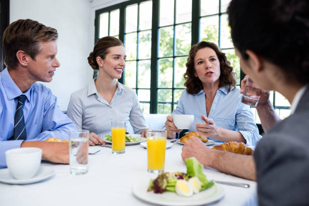 istock Business people having a meeting in restaurant 698688228