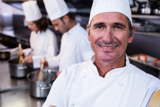 istock Portrait of smiling chef in commercial kitchen 698688350