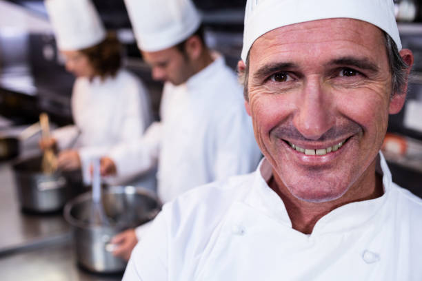 istock Portrait of smiling chef in commercial kitchen 698689590