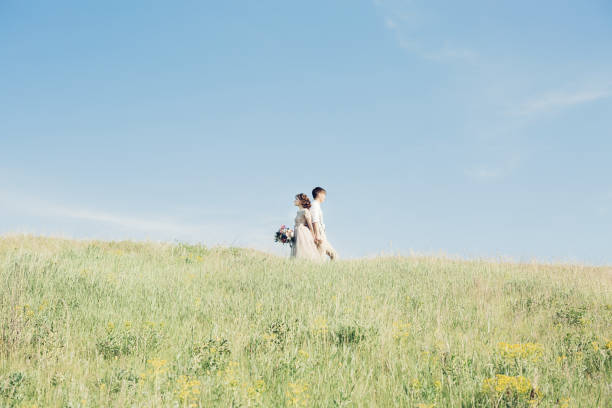 istock wedding couple on  nature.  bride and groom hugging at  wedding. 698696210