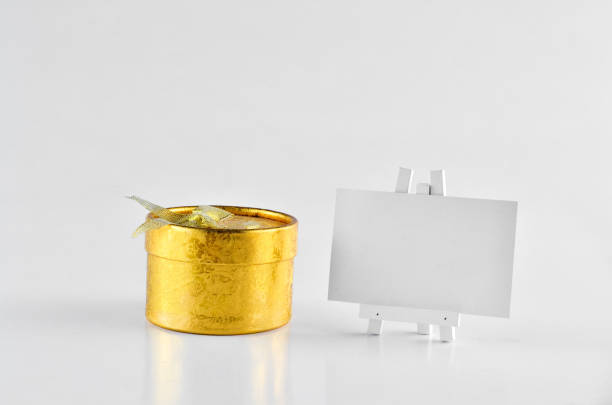 istock Golden Gift Box with white board for text Over white background 698696850