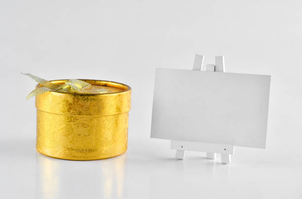 istock Golden Gift Box with white board for text Over white background 698697586