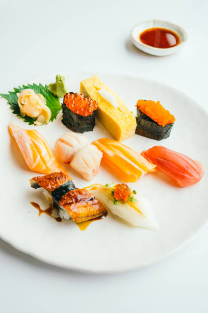 istock Raw and fresh nigiri sushi set in white plate 698697972