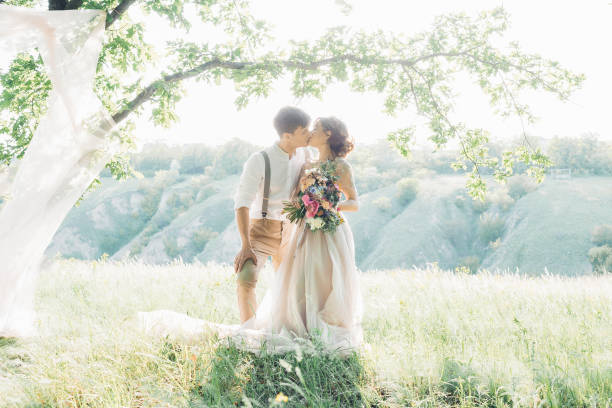 istock wedding couple on  nature.  bride and groom hugging at  wedding. 698704314