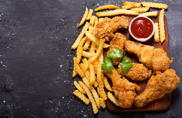 istock fried chicken and french fries 698717896