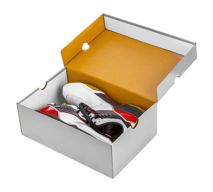 Sport sneakers in box isolated on white background