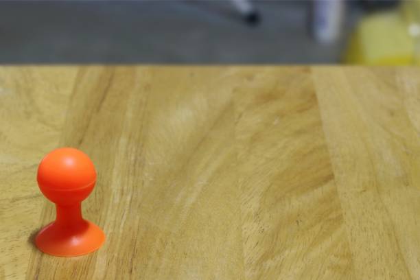 istock Select focus, rubber suction cup stand on floor wood 698733912