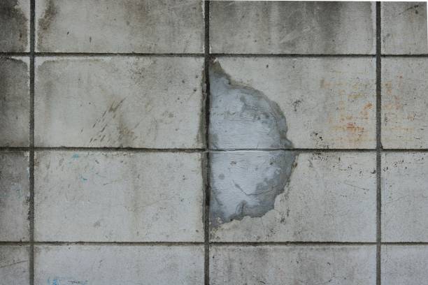 istock Old concrete wall crack repair 698733958