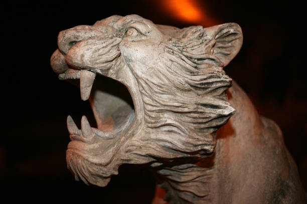 istock Sculpted head of a lion roaring in horizontal orientation 698738786