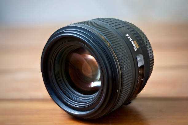 istock Lens on the Wood Table 698739434