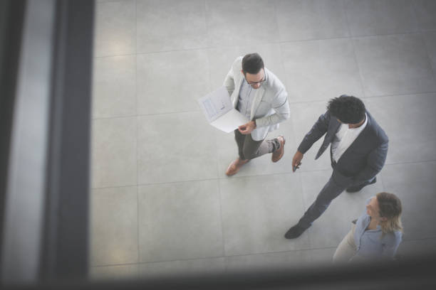 istock Business people walking in business building and having conversation. Space for copy. 698740154