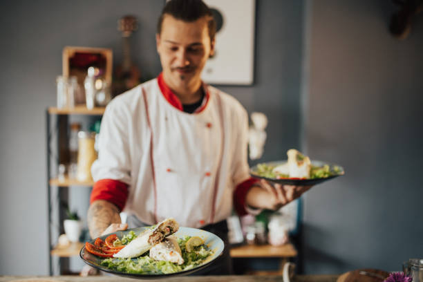 istock Beautiful hipster cook proud with his creation 698745894