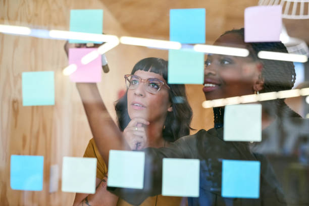 Let's take it from here Cropped shot of two designers having a brainstorming session set your goals stock pictures, royalty-free photos & images