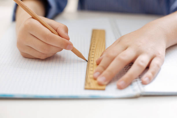 istock Neat charming child tracing a straight line 698748326