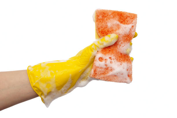 istock Hand in yellow rubber glove 698748362