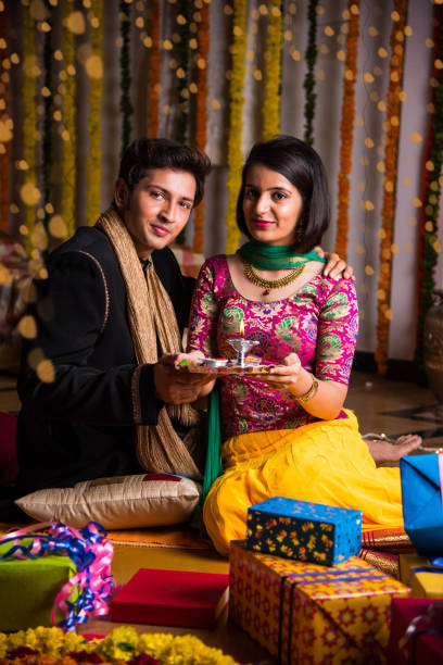 istock Indian young couple celebrating diwali 698753622