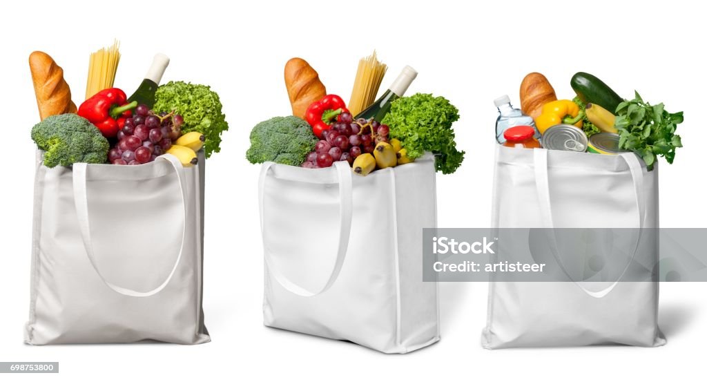 Groceries. Shopping bags with groceries isolated on white background Groceries Stock Photo