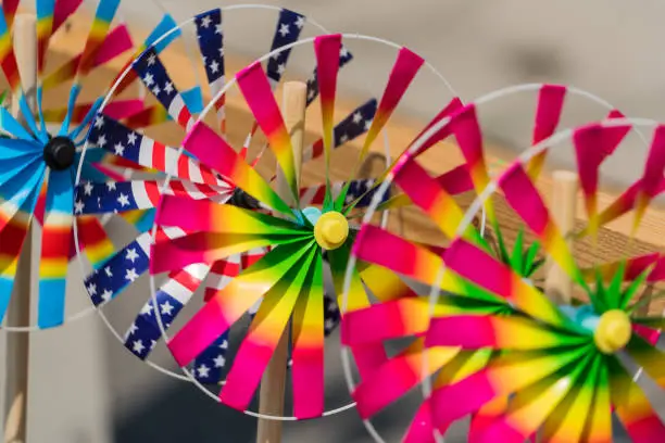 Photo of Close up the rainbow pinwheel toy, colorful turbines toy