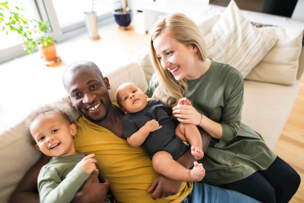 young interracial family with little children at home. - african ethnicity brother ethnic little boys imagens e fotografias de stock