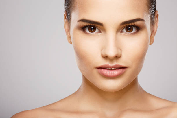 istock Stunning girl with nude make up at studio 698765932