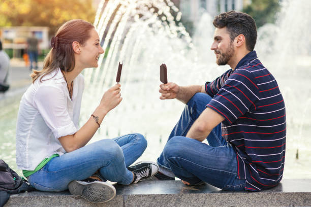 istock Couple eating ice-cream together 698766340