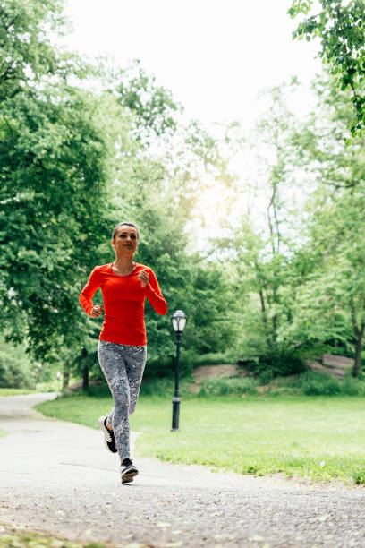 istock Beautiful young woman running. 698773186