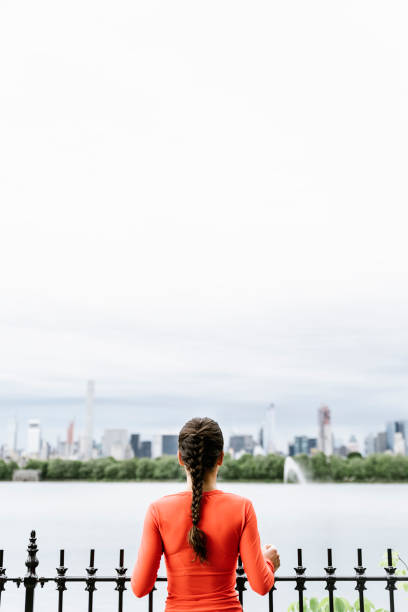 istock Beautiful young woman looking Manhattan. 698778494