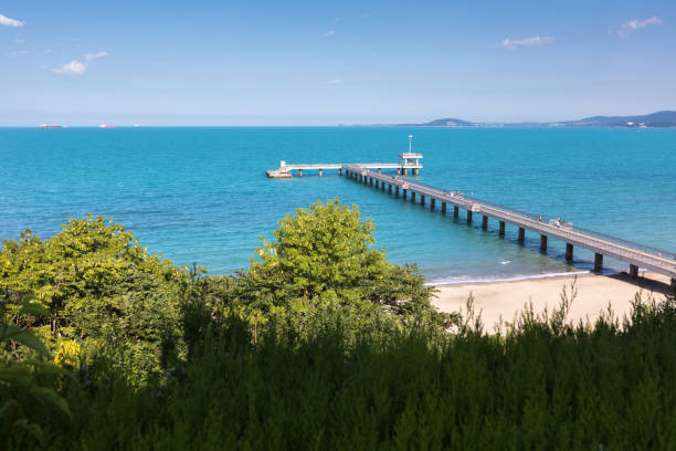 Long bridge in the blue sea