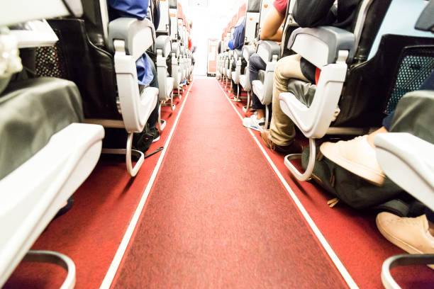 istock Floor proximity reflector line aids airplane evacuation under dark conditions. 698780306