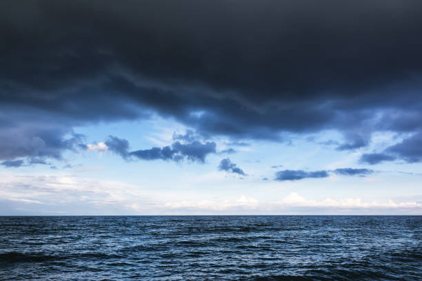 istock Dramatic stormy sky with dark clouds over the sea. 698780756